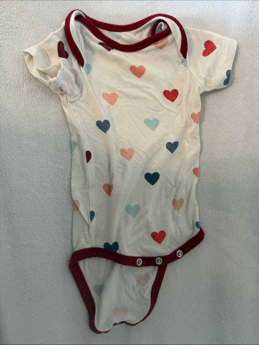Kyte baby Heart-Print One-Piece Bodysuit in White with Multicolor Hearts